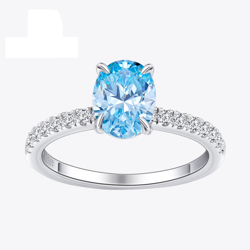 Stříbrný prsten s oválným světle modrým zirkonem a čirými zirkony po stranách Stříbrný prsten s oválným světle modrým zirkonem a čirými zirkony po stranách