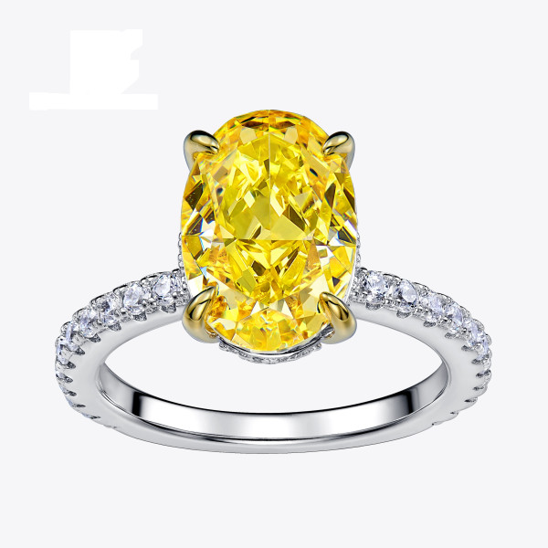 Stříbrný prsten s oválným žlutým zirkonem a zlacenými krapnami