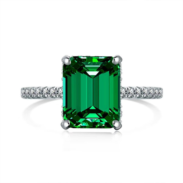 Stříbrný prsten se syntetickým smaragdem a čirými zirkony do půlky prstenu